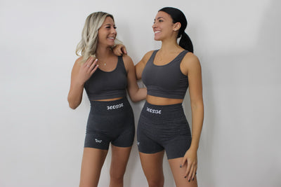 Model Stephanie (left) is 5'2 wearing a size S. Model Anjelica (right) is 5'4 wearing a size M in ICONIC WAIST SCULPTING SHORTS.