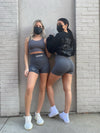 Model Stephanie (left) is 5'2 wearing a size S. Model Anjelica (right) is 5'4 wearing a size M in ICONIC WAIST SCULPTING SHORTS.